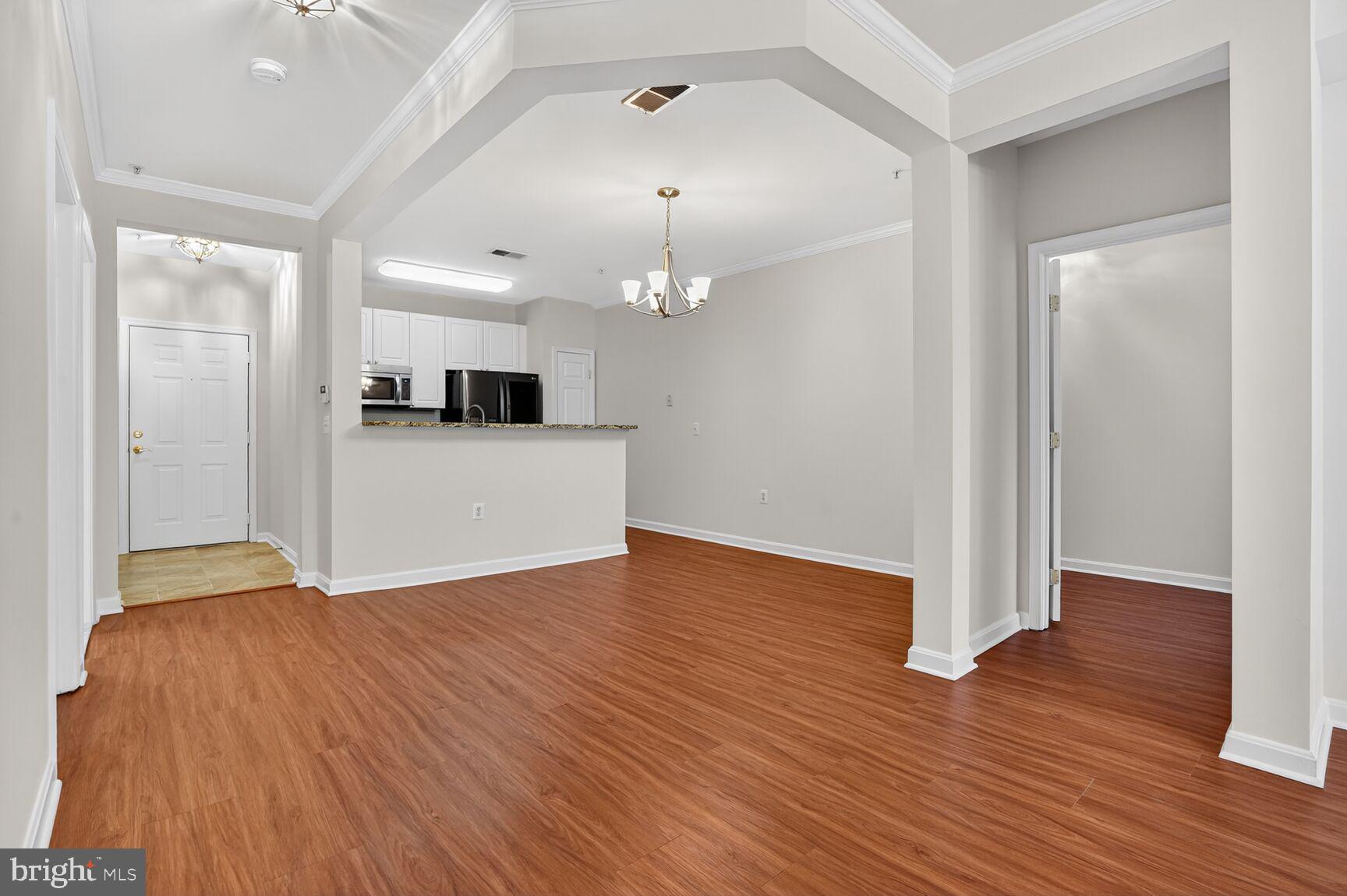 4300 Cannon Ridge Court, Unit 14 Fairfax, VA 22033 - Photo 5 of 23 a view of a kitchen with wooden floor and a refrigerator