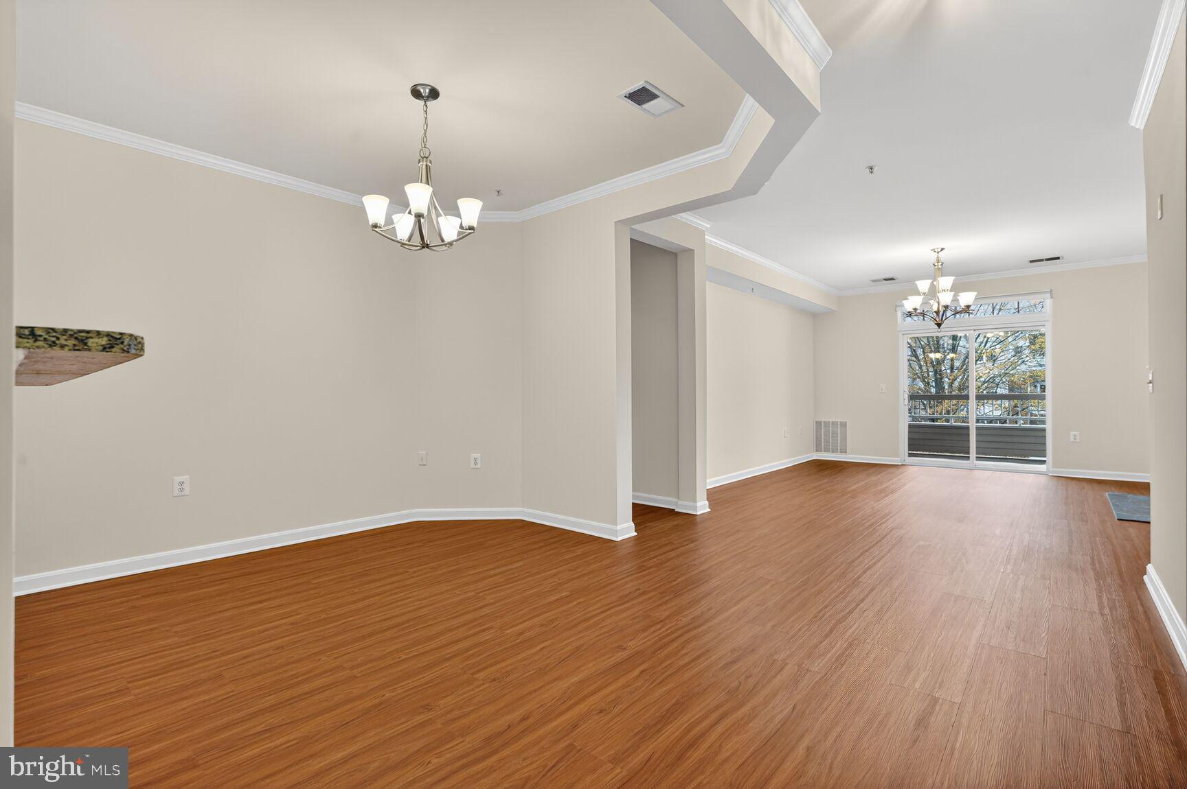 4300 Cannon Ridge Court, Unit 14 Fairfax, VA 22033 - Photo 6 of 23 wooden floor in an empty room with a window
