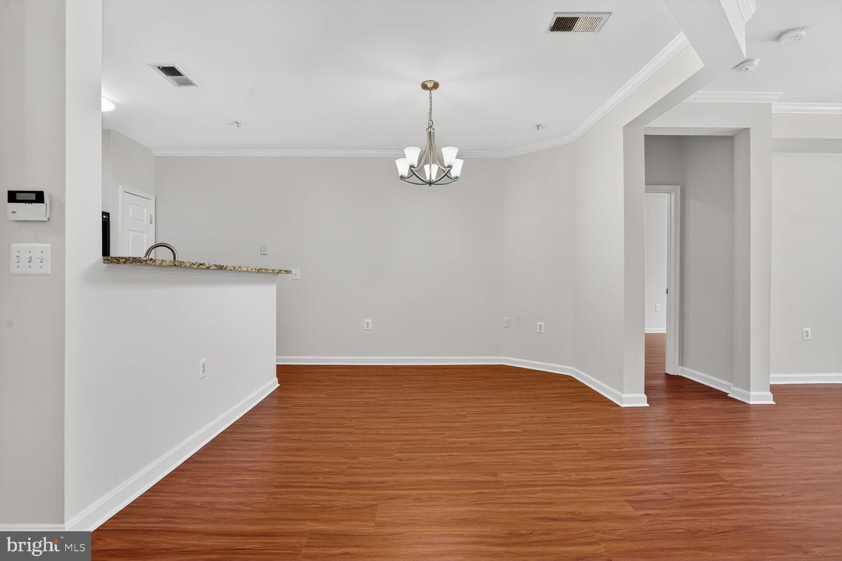 4300 Cannon Ridge Court, Unit 14 Fairfax, VA 22033 - Photo 8 of 23 a view of a kitchen with wooden floor and a ceiling fan