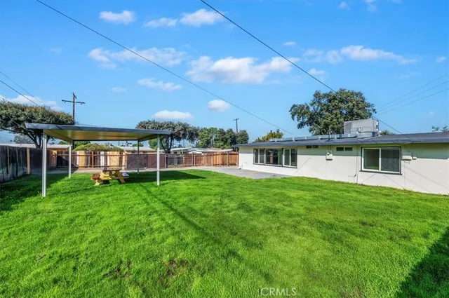 a view of a house with a big yard