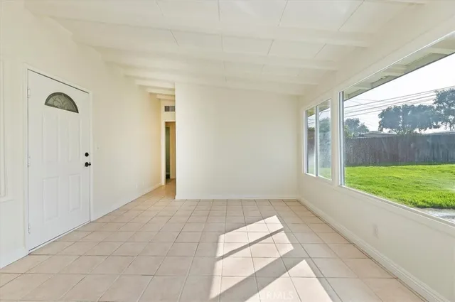 a view of an empty room and window