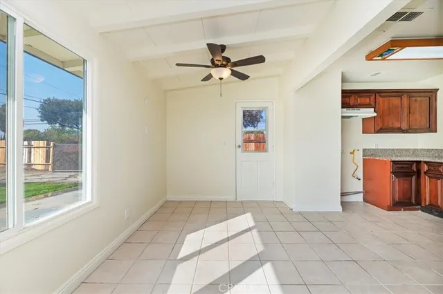 a view of an entryway with a chandelier fan