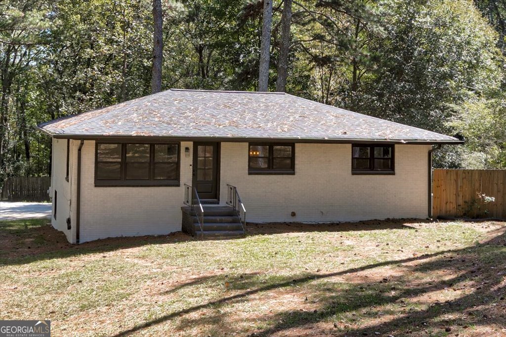 1908 Kimberly Road Southwest Atlanta, GA 30331 - Photo 1 of 1 a house with trees in the background