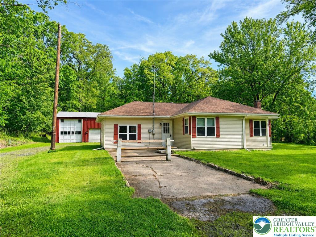 4995 Mountain Road Slatington, PA 18080 - Photo 29 of 30 A charming single-level residence featuring a detached red barn and lush green surroundings.