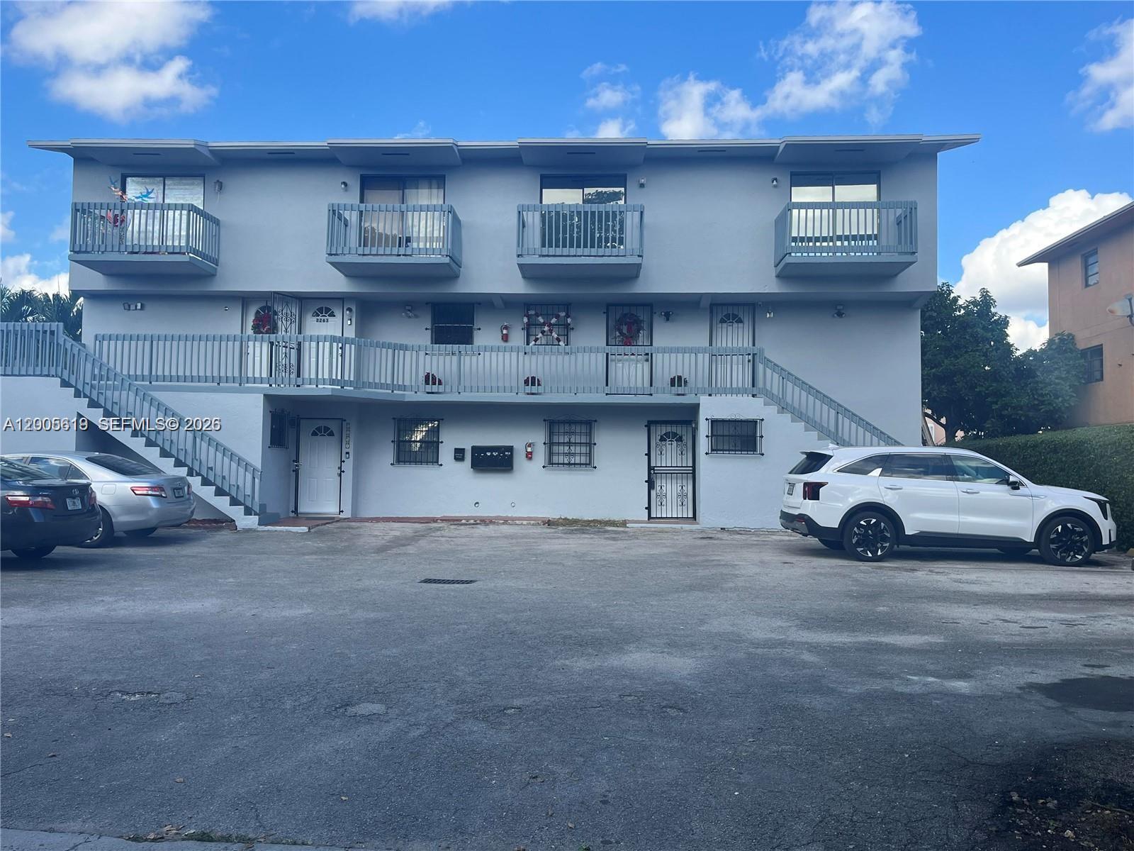 2255 West 55th Street, Unit 2 Hialeah, FL 33016 - Photo 8 of 11 a view of a car parked in front of a building