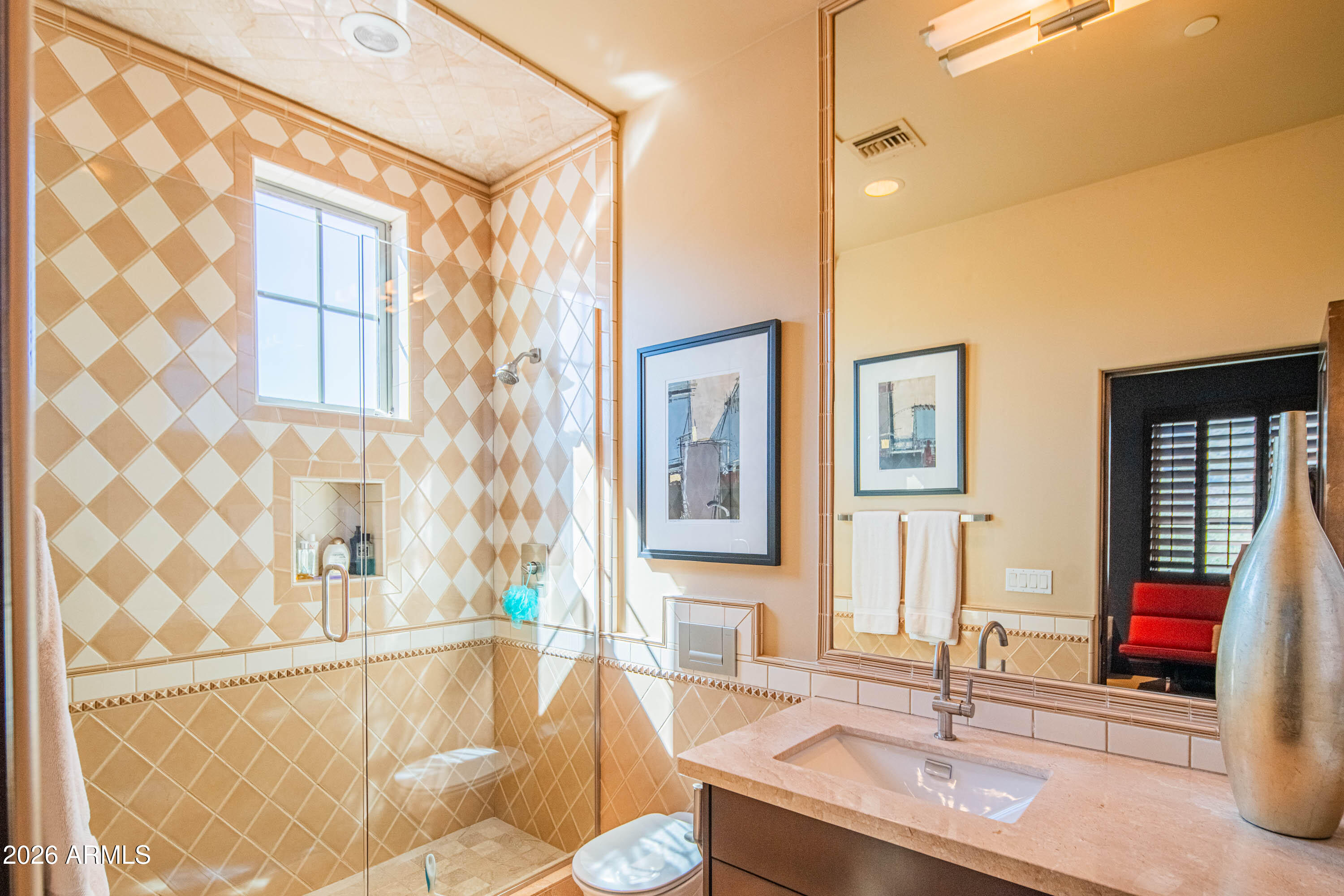 21401 West Granite Ridge Road Buckeye, AZ 85396 - Photo 102 of 144 a bathroom with a granite countertop sink a large mirror and a shower