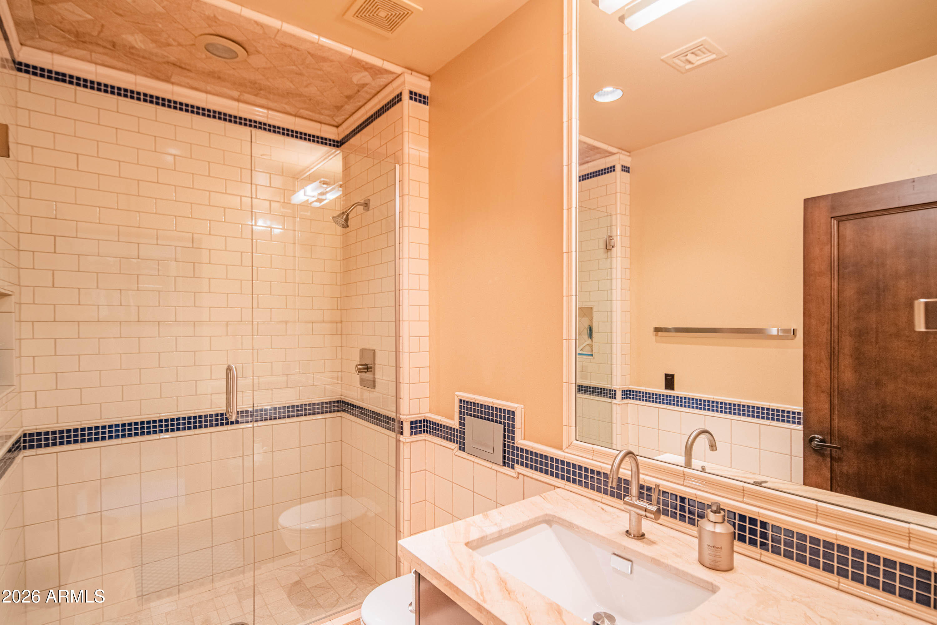 21401 West Granite Ridge Road Buckeye, AZ 85396 - Photo 105 of 144 a bathroom with a sink and a shower