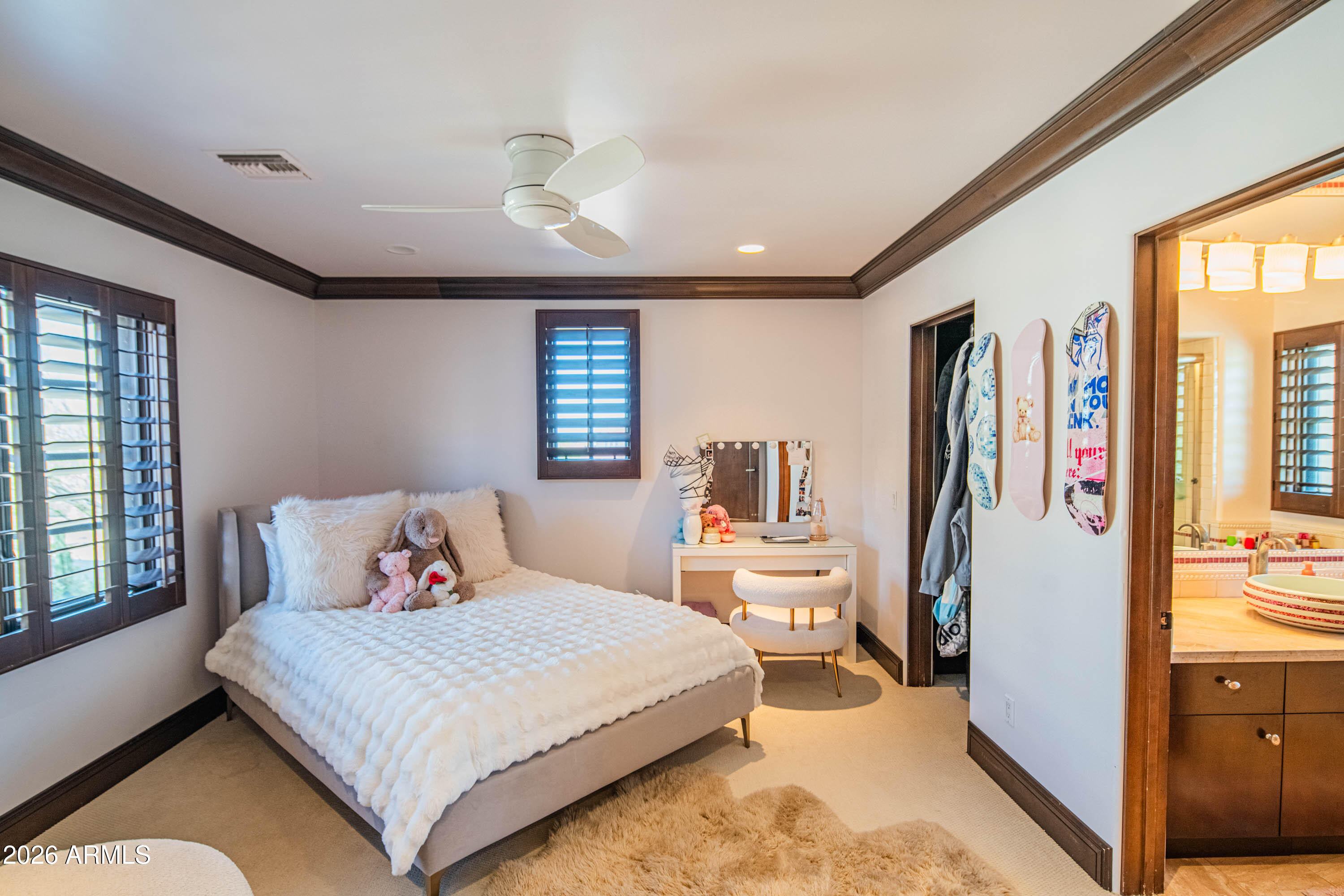 21401 West Granite Ridge Road Buckeye, AZ 85396 - Photo 111 of 144 a bedroom with a bed and wooden floor