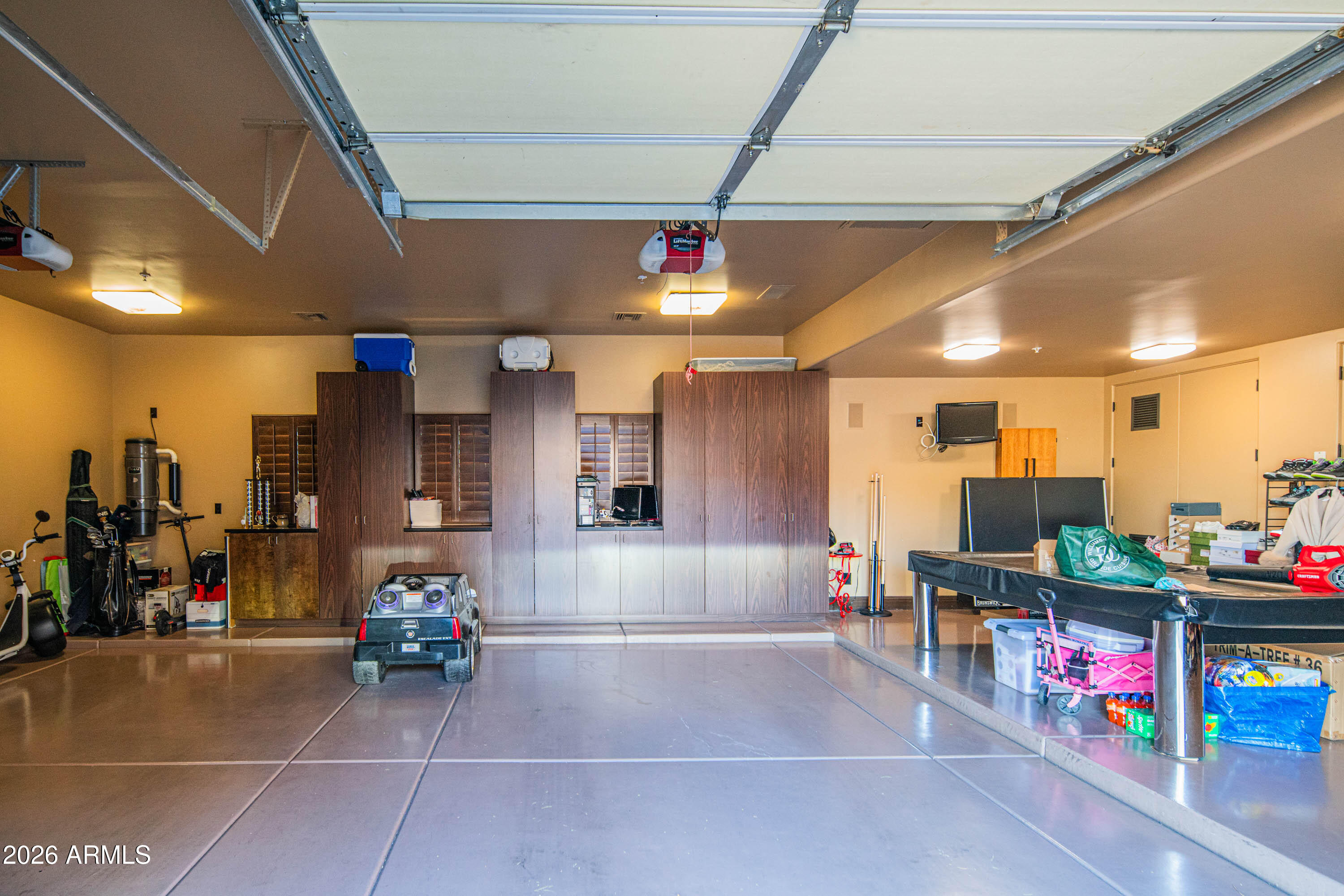 21401 West Granite Ridge Road Buckeye, AZ 85396 - Photo 143 of 144 a living room with lots of furniture and a flat screen tv