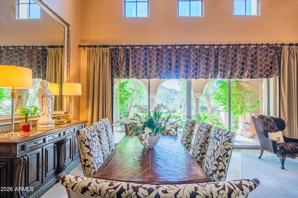 a view of walk in closet with clothes