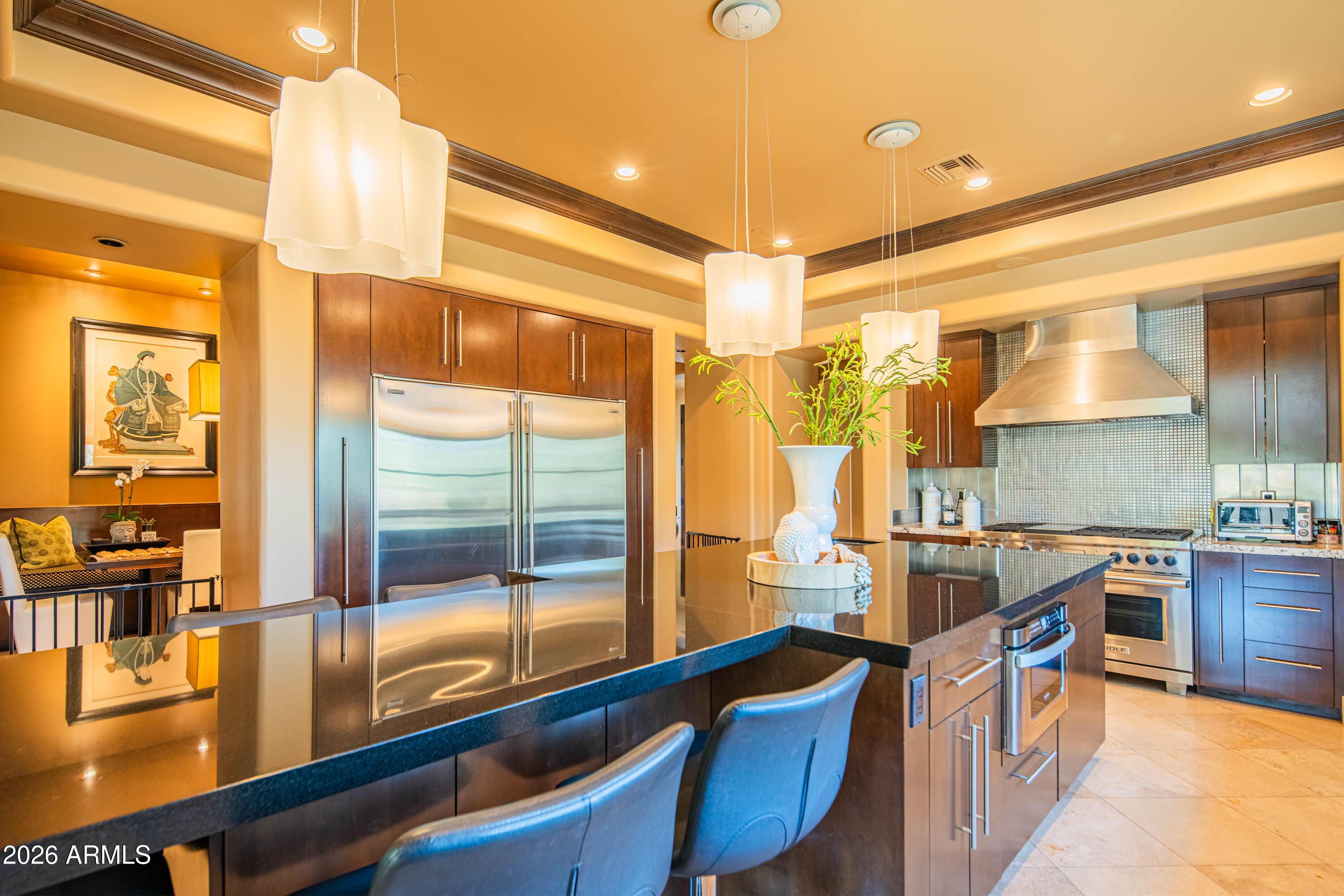 21401 West Granite Ridge Road Buckeye, AZ 85396 - Photo 32 of 144 a kitchen with stainless steel appliances a sink and a large window