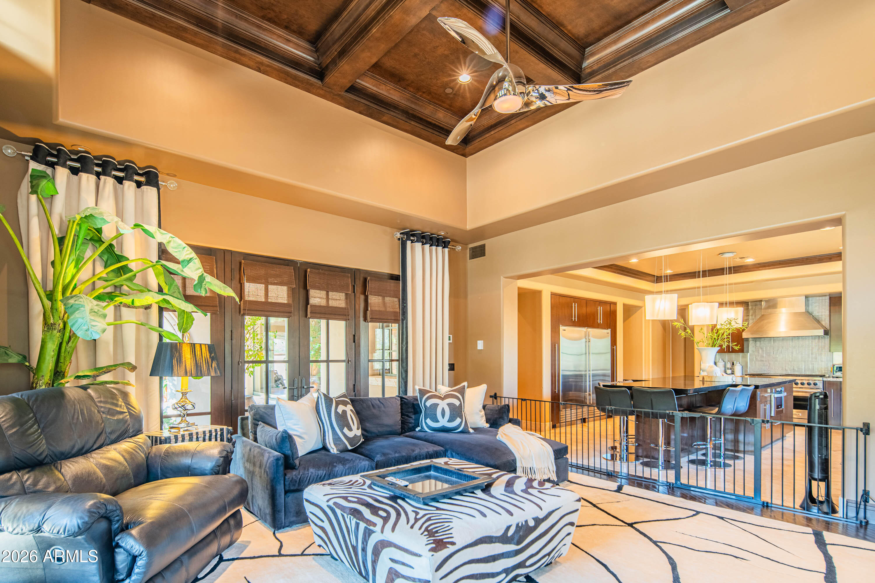21401 West Granite Ridge Road Buckeye, AZ 85396 - Photo 37 of 144 a living room with furniture and a floor to ceiling window