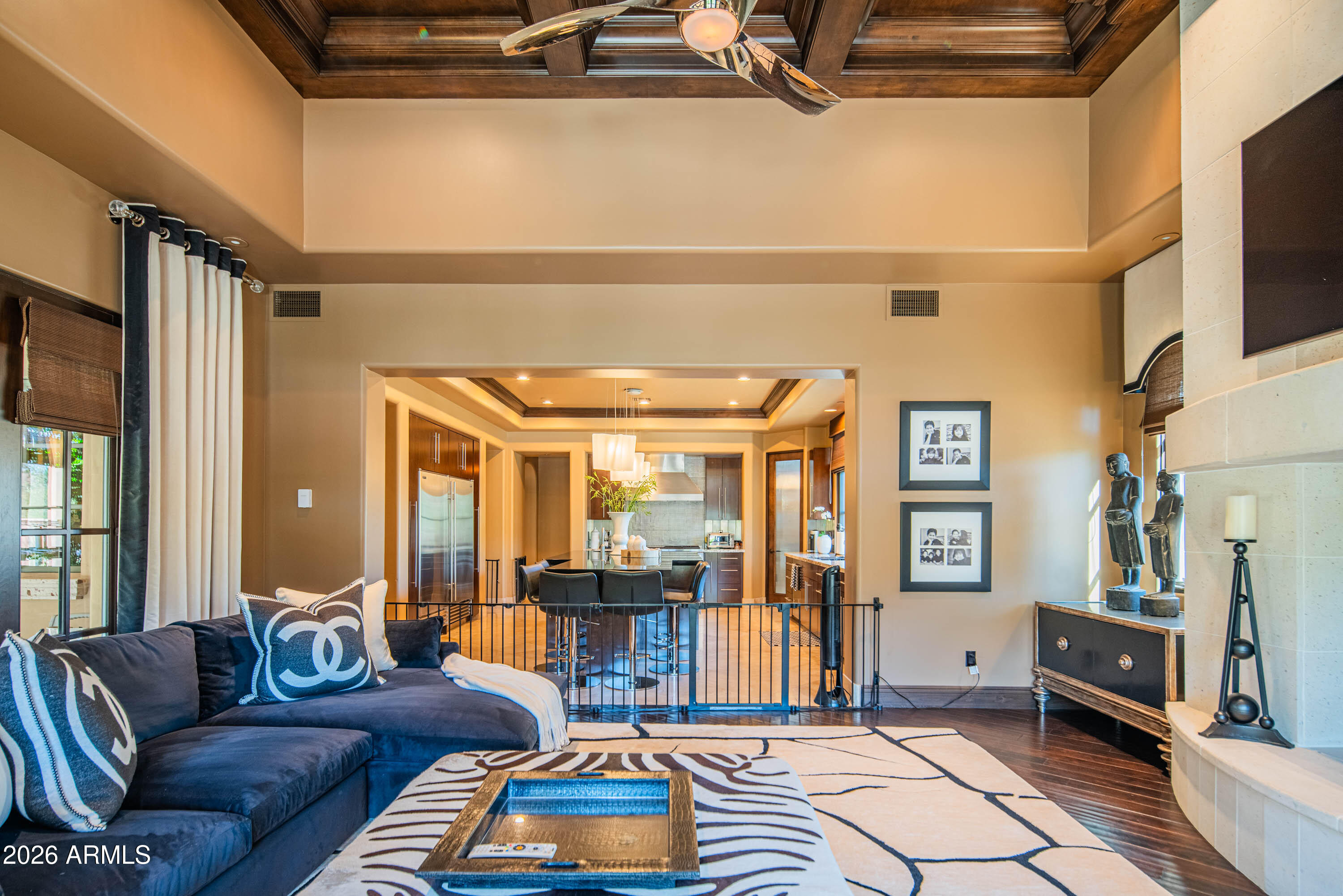 21401 West Granite Ridge Road Buckeye, AZ 85396 - Photo 39 of 144 a living room with furniture a flat screen tv and a refrigerator