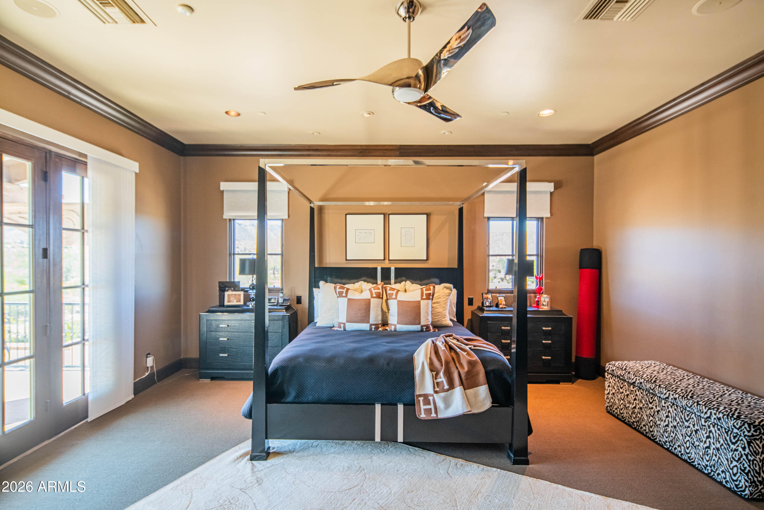 21401 West Granite Ridge Road Buckeye, AZ 85396 - Photo 44 of 144 a bedroom with furniture and large windows