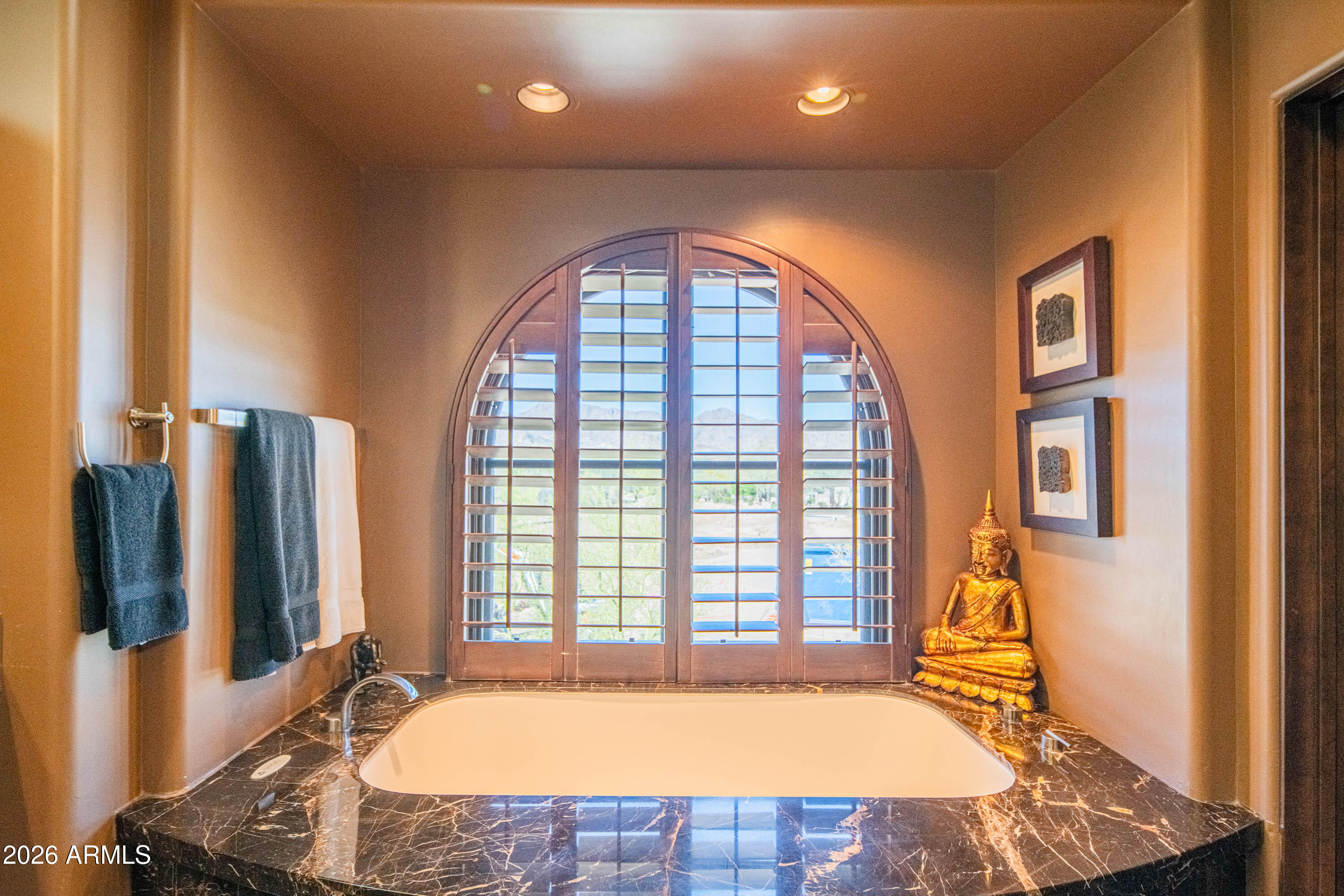 21401 West Granite Ridge Road Buckeye, AZ 85396 - Photo 47 of 144 a view of a spacious bathroom with a tub and large windows