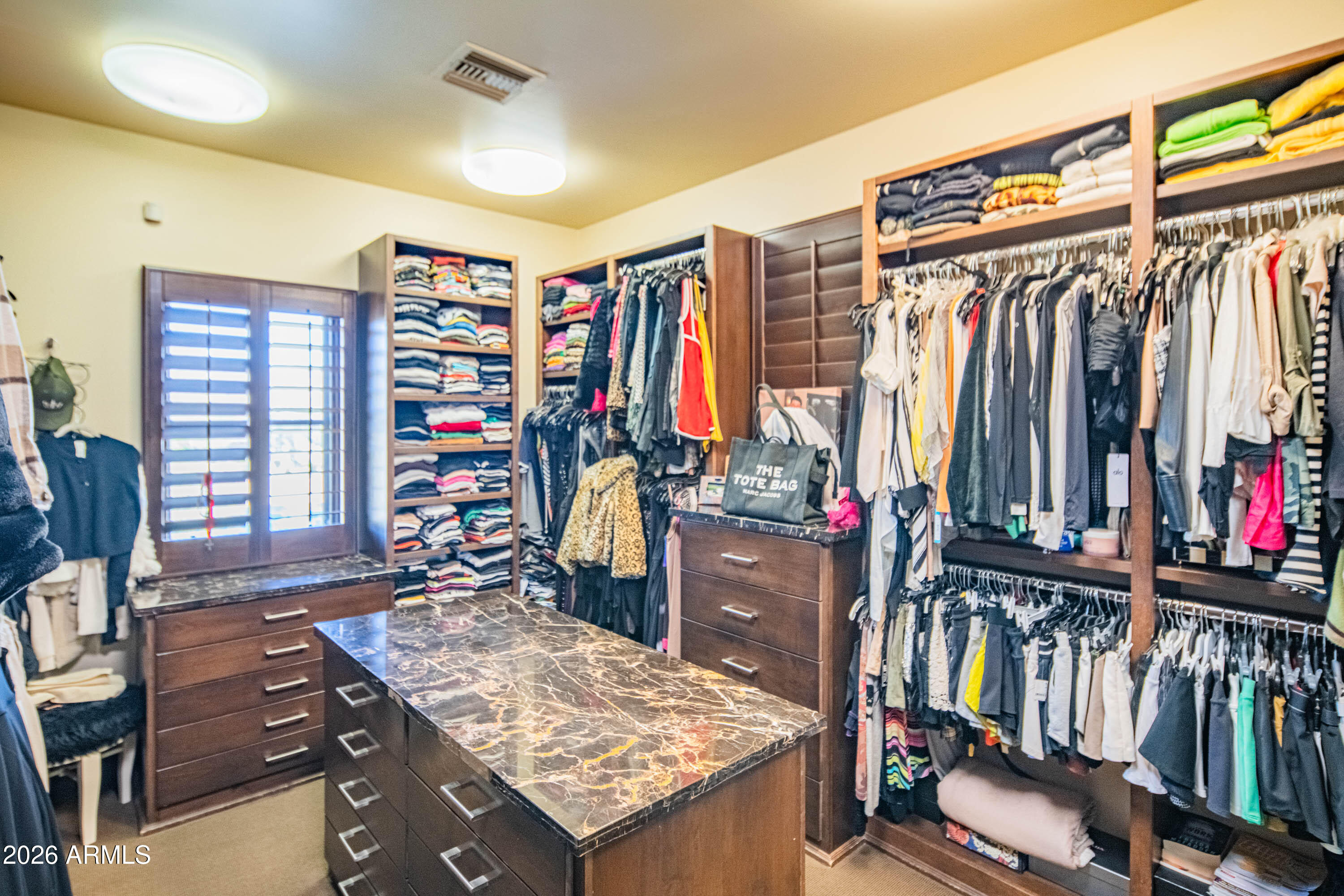 21401 West Granite Ridge Road Buckeye, AZ 85396 - Photo 52 of 144 a view of a walk in closet