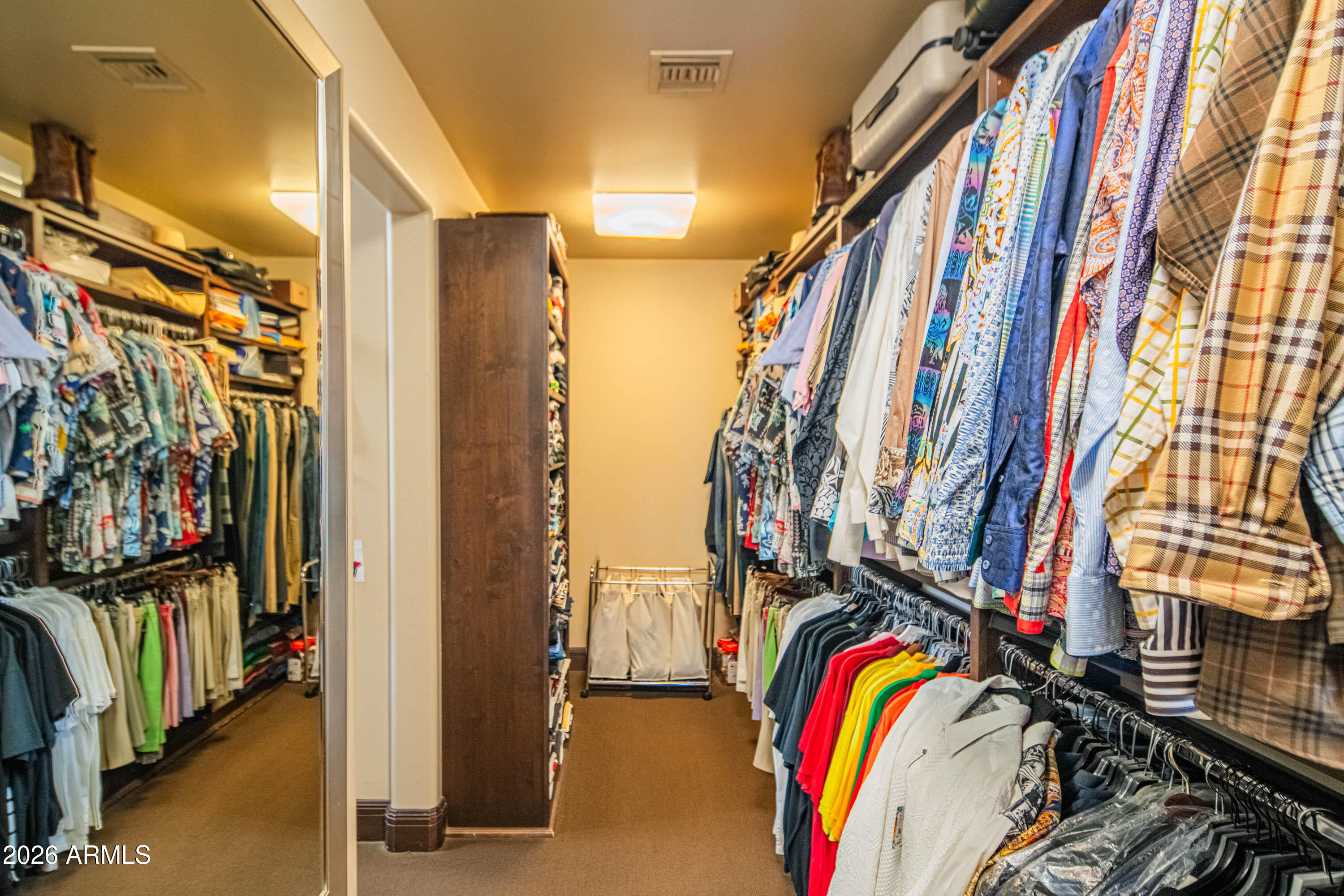 21401 West Granite Ridge Road Buckeye, AZ 85396 - Photo 53 of 144 a view of walk in closet with clothes