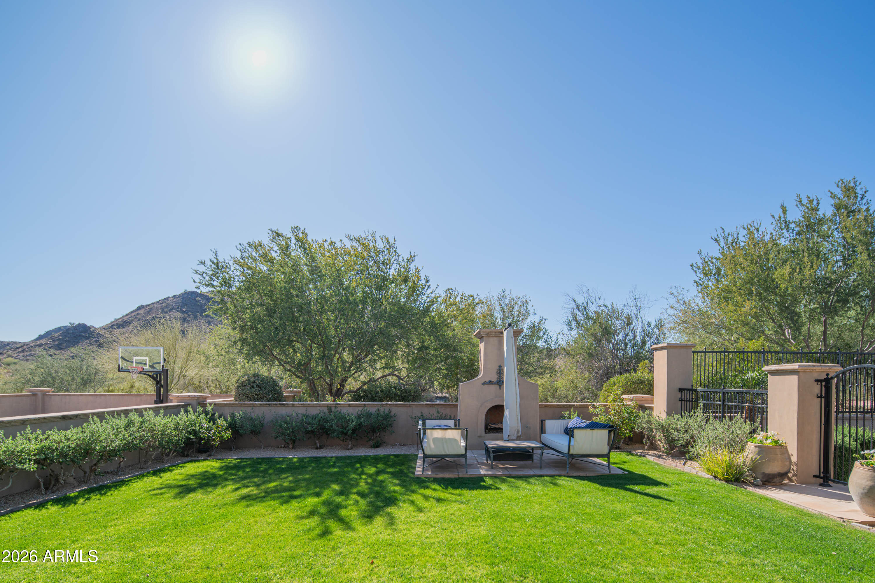 21401 West Granite Ridge Road Buckeye, AZ 85396 - Photo 75 of 144 a view of a chair and table in the garden