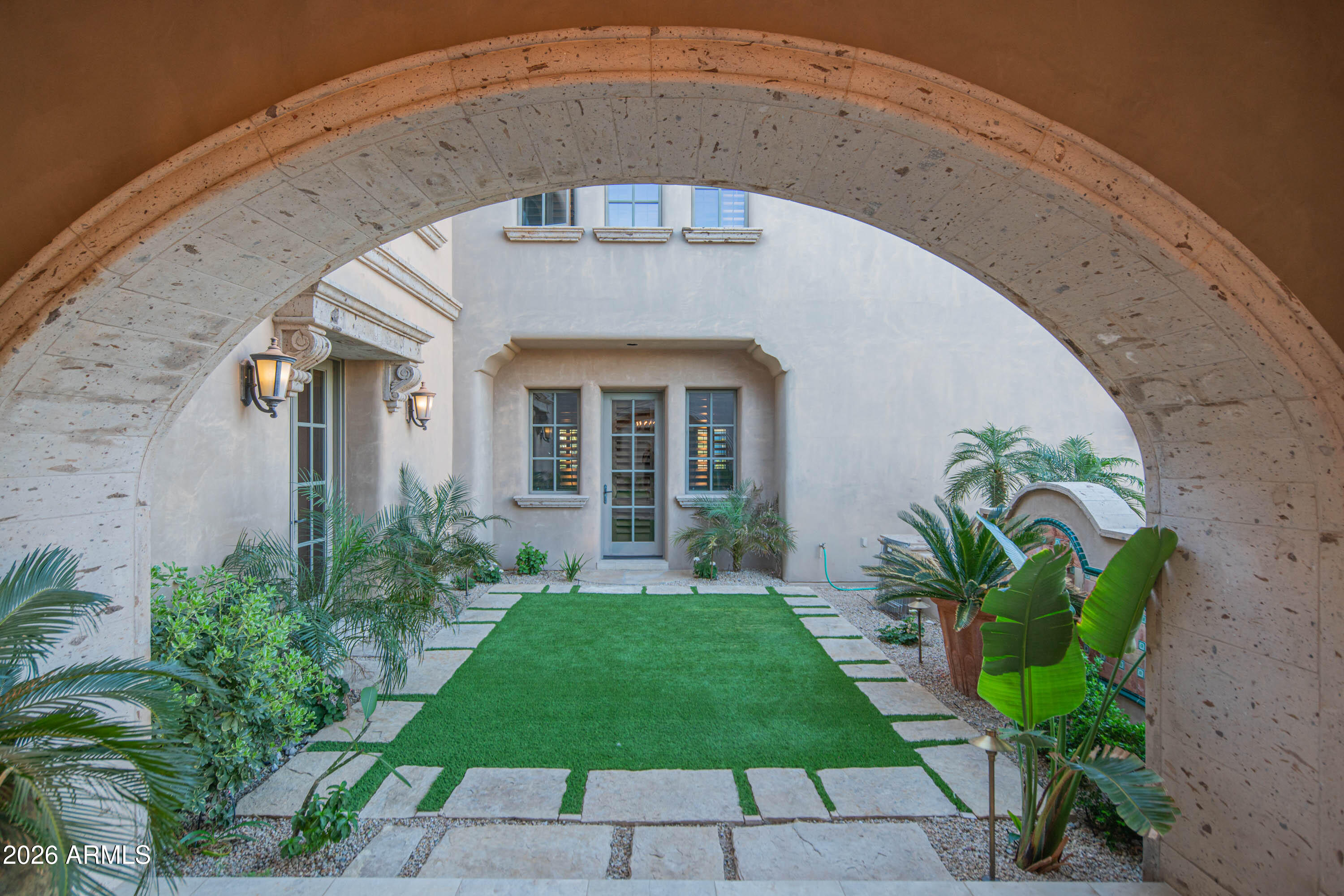 21401 West Granite Ridge Road Buckeye, AZ 85396 - Photo 78 of 144 a front view of a house with a garden