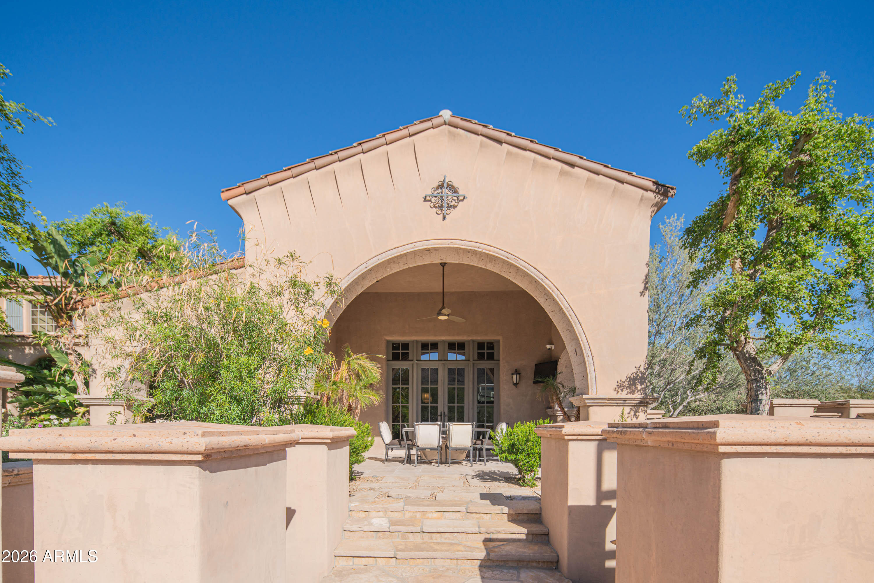 21401 West Granite Ridge Road Buckeye, AZ 85396 - Photo 81 of 144 a view of a grey house with large windows