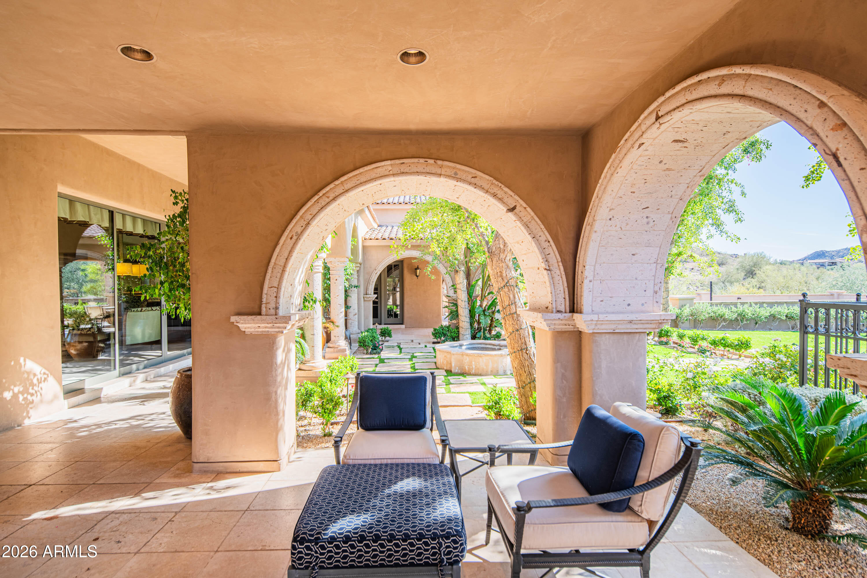 21401 West Granite Ridge Road Buckeye, AZ 85396 - Photo 85 of 144 a living room with couches a coffee table and a potted plant