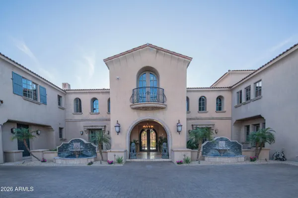 a view of a patio with couches table and chairs and potted plants