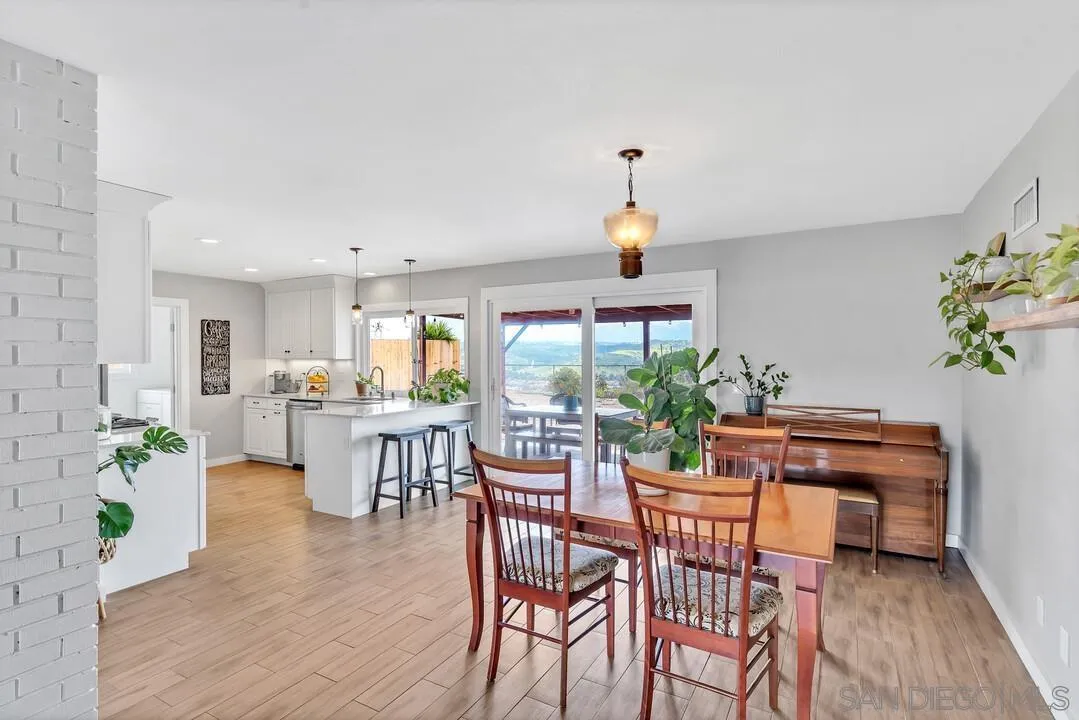 13415 Pequot Drive Poway, CA 92064 - Photo 12 of 63 a view of a dining room with furniture window and wooden floor