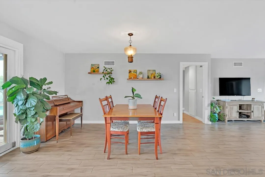 13415 Pequot Drive Poway, CA 92064 - Photo 13 of 63 a view of a dining room with furniture window and wooden floor