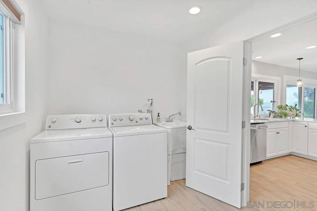 13415 Pequot Drive Poway, CA 92064 - Photo 19 of 63 a view of washer and dryer with bathroom in the background