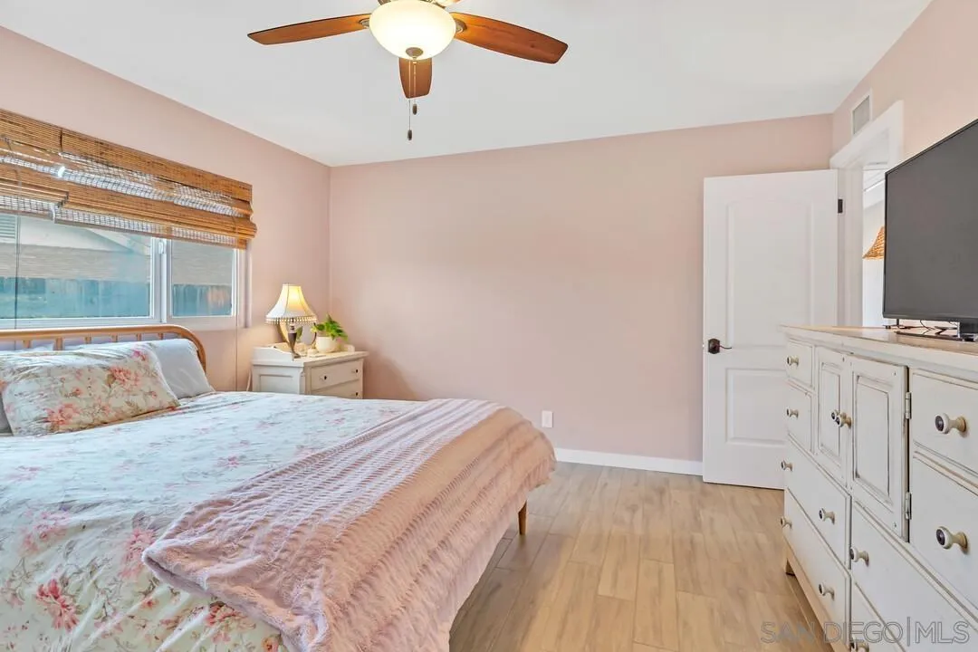 13415 Pequot Drive Poway, CA 92064 - Photo 22 of 63 a bedroom with a bed and a flat tv screen on dresser
