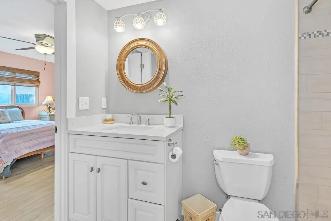 13415 Pequot Drive Poway, CA 92064 - Photo 23 of 63 a bathroom with a sink a toilet and a mirror