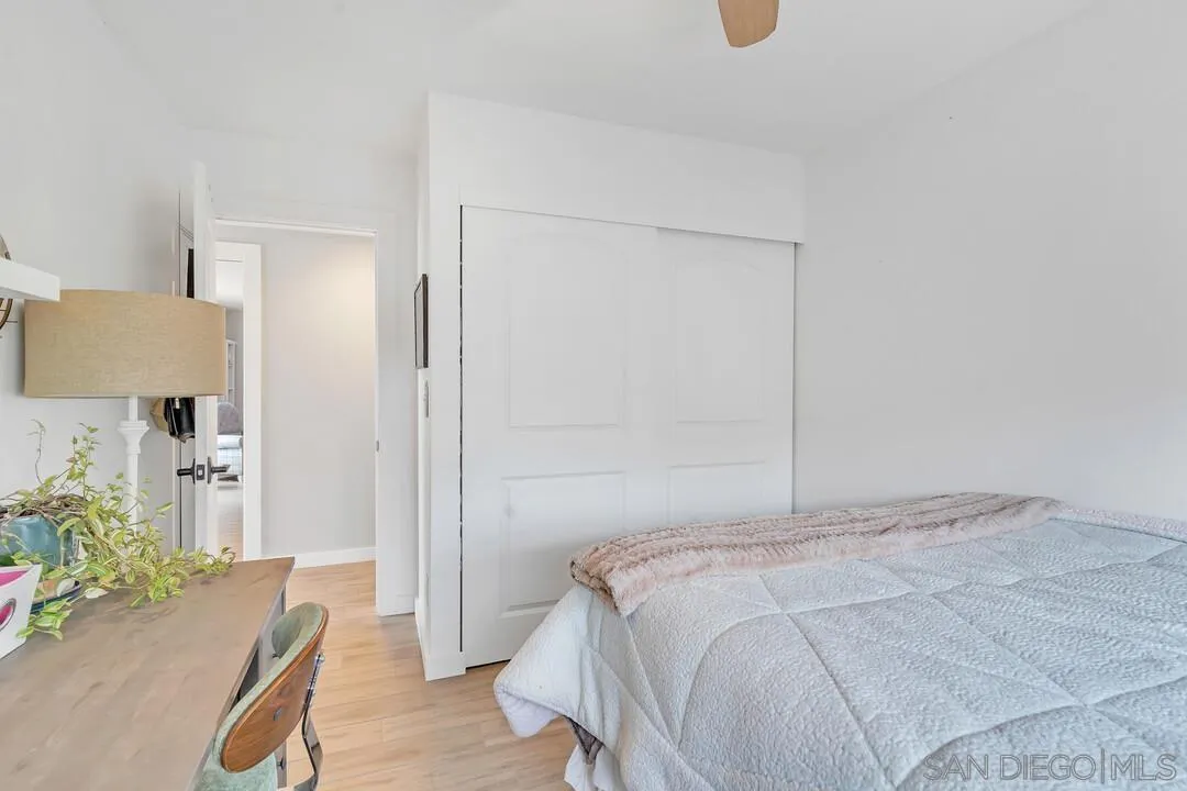 13415 Pequot Drive Poway, CA 92064 - Photo 26 of 63 a bedroom with a bed and potted plant