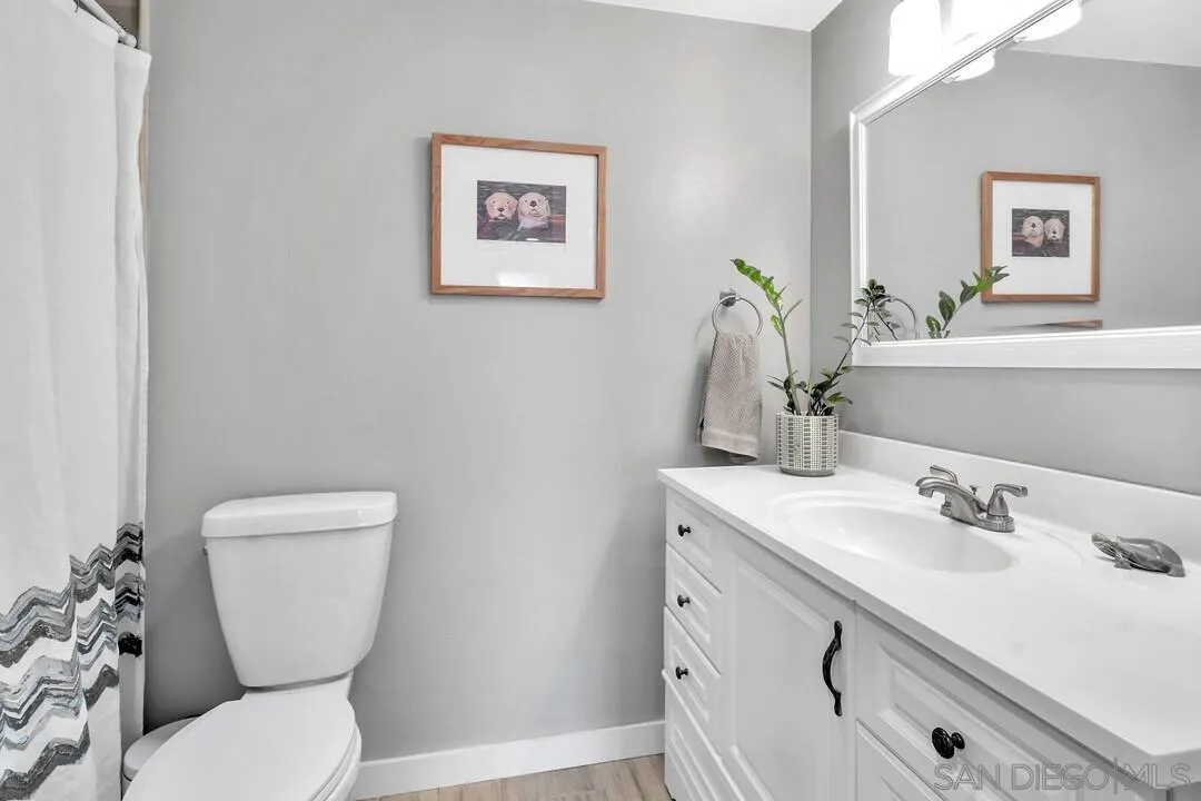 13415 Pequot Drive Poway, CA 92064 - Photo 29 of 63 a bathroom with a toilet sink and mirror