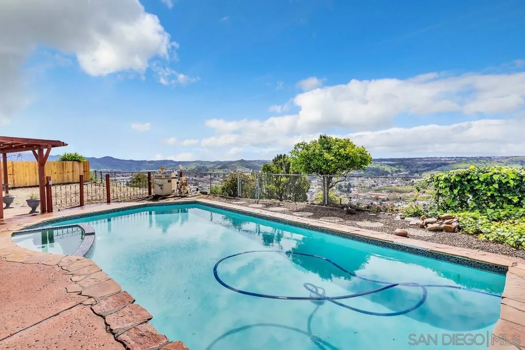 13415 Pequot Drive Poway, CA 92064 - Photo 36 of 63 a view of a swimming pool with a chairs