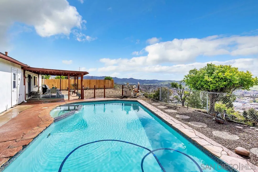 13415 Pequot Drive Poway, CA 92064 - Photo 37 of 63 a view of a swimming pool with a lounge chair