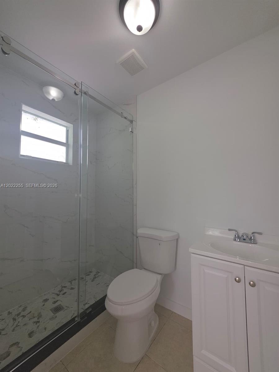 829 Southwest 3rd Street, Unit 831 Miami, FL 33130 - Photo 4 of 21 a white toilet sitting next to a bathroom sink