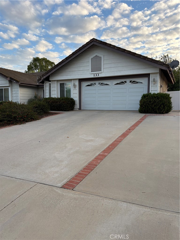 133 Cannon Road Riverside, CA 92506 - Photo 2 of 32 a view of a house with a garage
