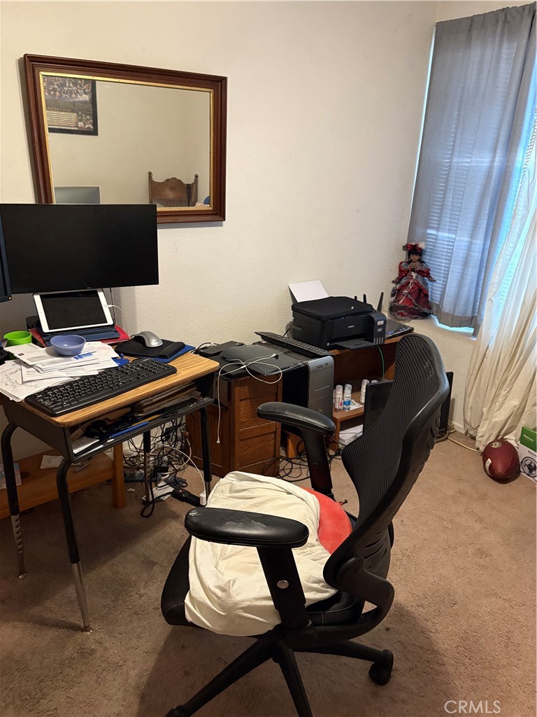 133 Cannon Road Riverside, CA 92506 - Photo 22 of 32 a workspace with furniture and rug