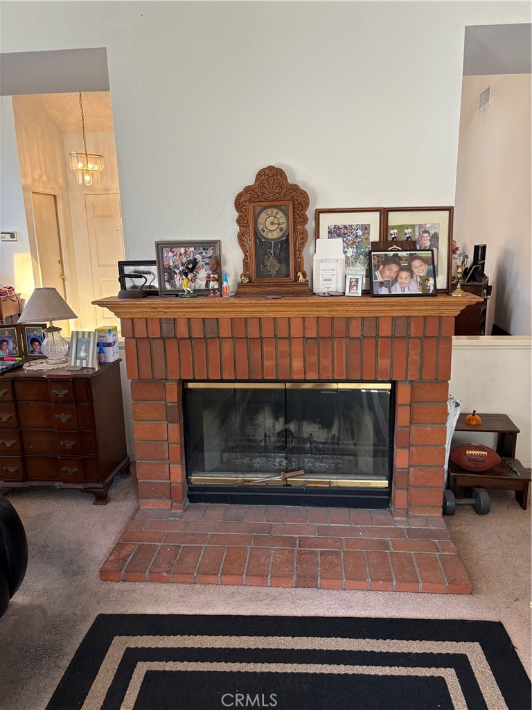 133 Cannon Road Riverside, CA 92506 - Photo 26 of 32 a living room with furniture and a fireplace