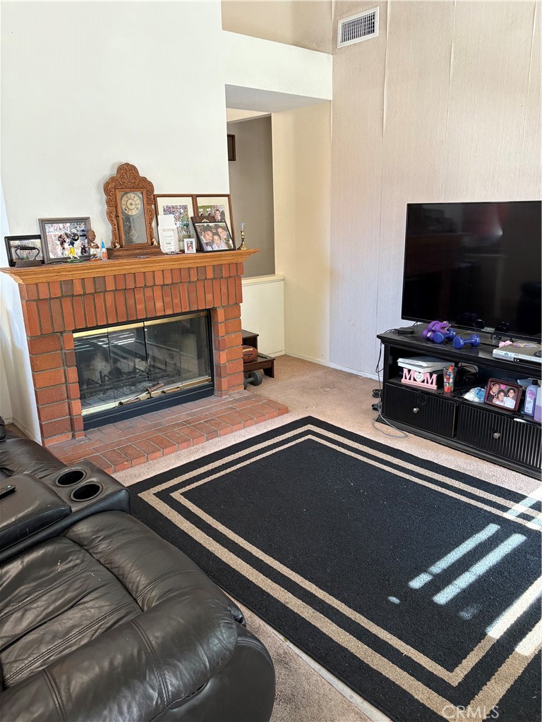 133 Cannon Road Riverside, CA 92506 - Photo 27 of 32 a living room with furniture fireplace and flat screen tv