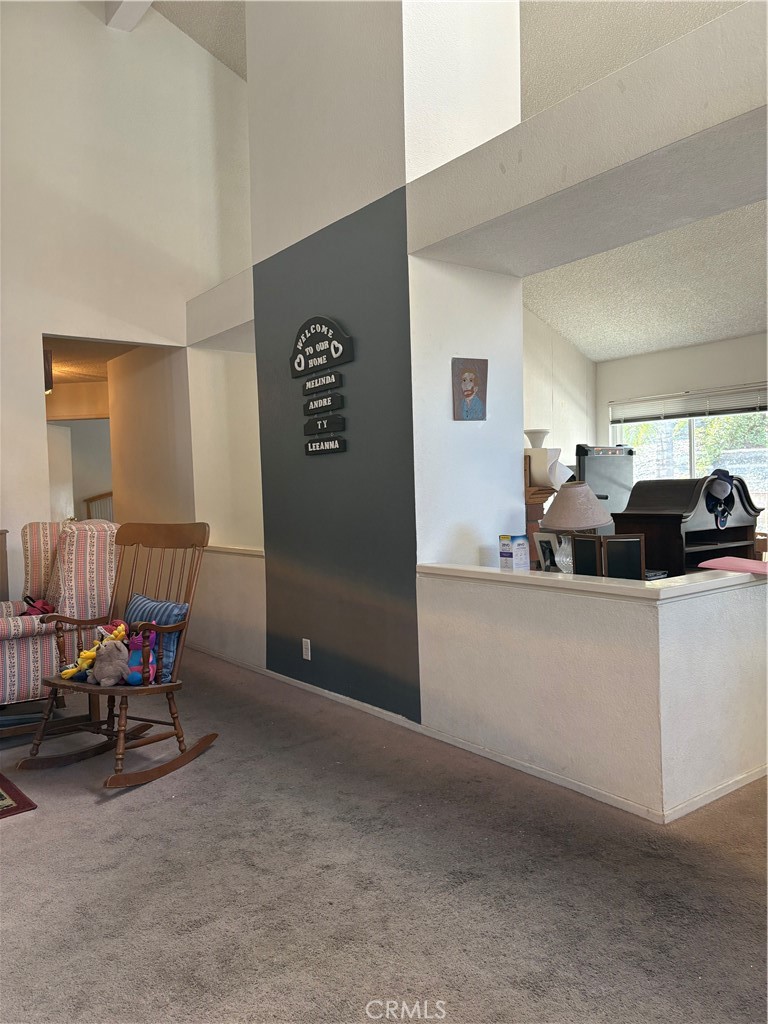 133 Cannon Road Riverside, CA 92506 - Photo 10 of 32 a living room with furniture and a window