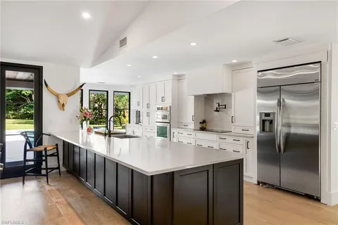 a kitchen with counter top space cabinets and stainless steel appliances