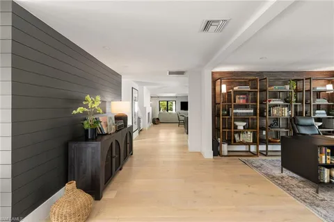 a view of a livingroom with furniture and staircase