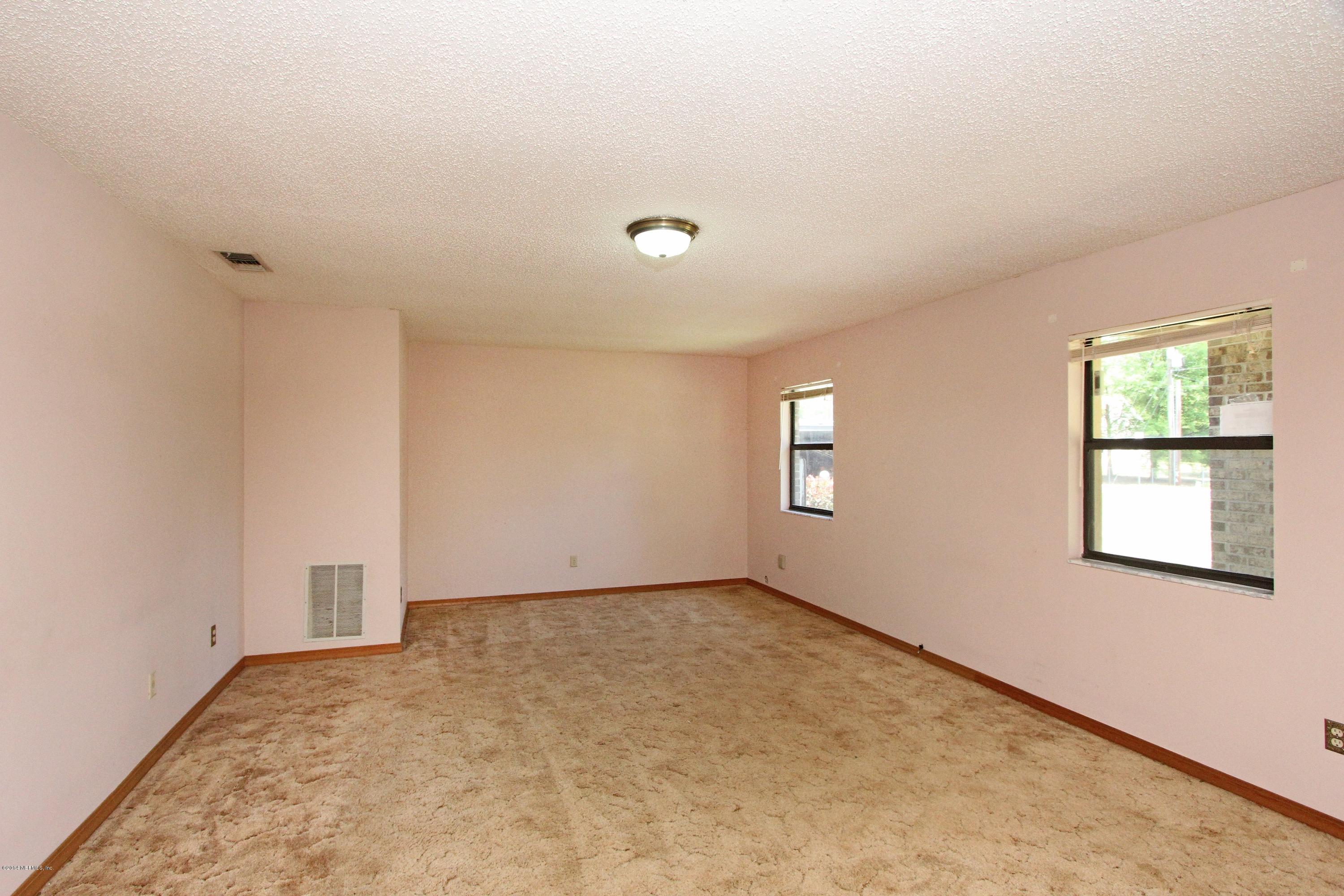 54421 Sheffield Road Callahan, FL 32011 - Photo 2 of 16 an empty room with windows