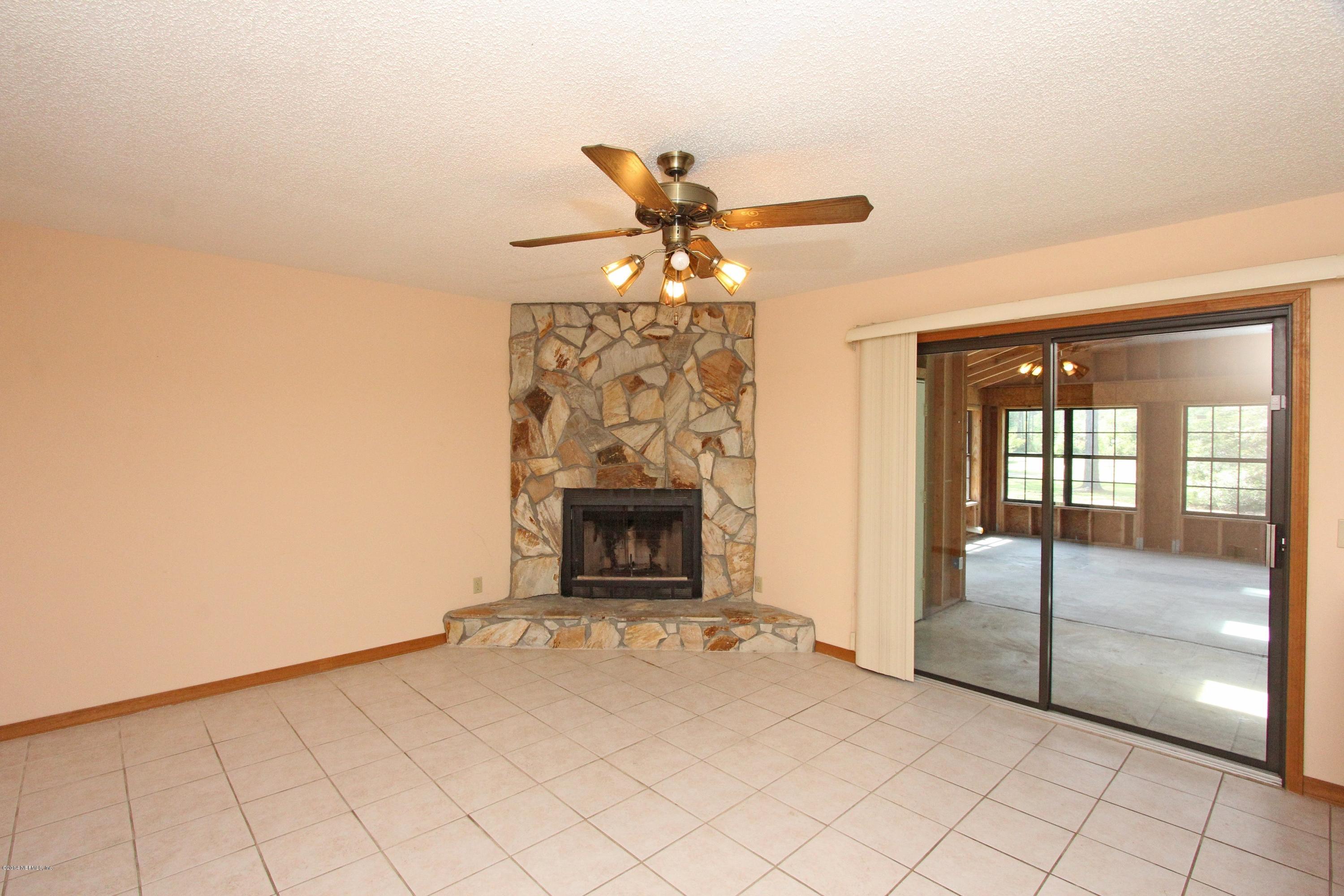 54421 Sheffield Road Callahan, FL 32011 - Photo 3 of 16 a view of a livingroom with a fireplace