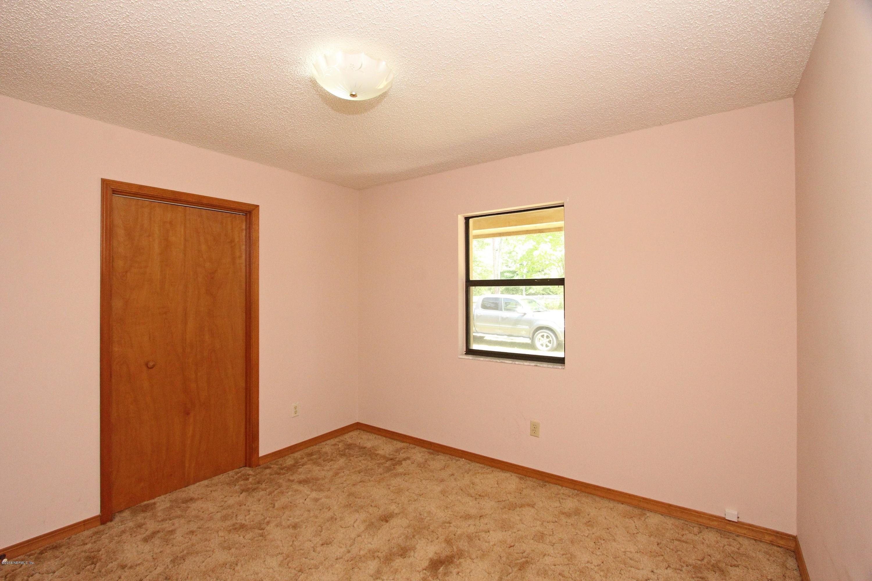 54421 Sheffield Road Callahan, FL 32011 - Photo 8 of 16 an empty room with windows