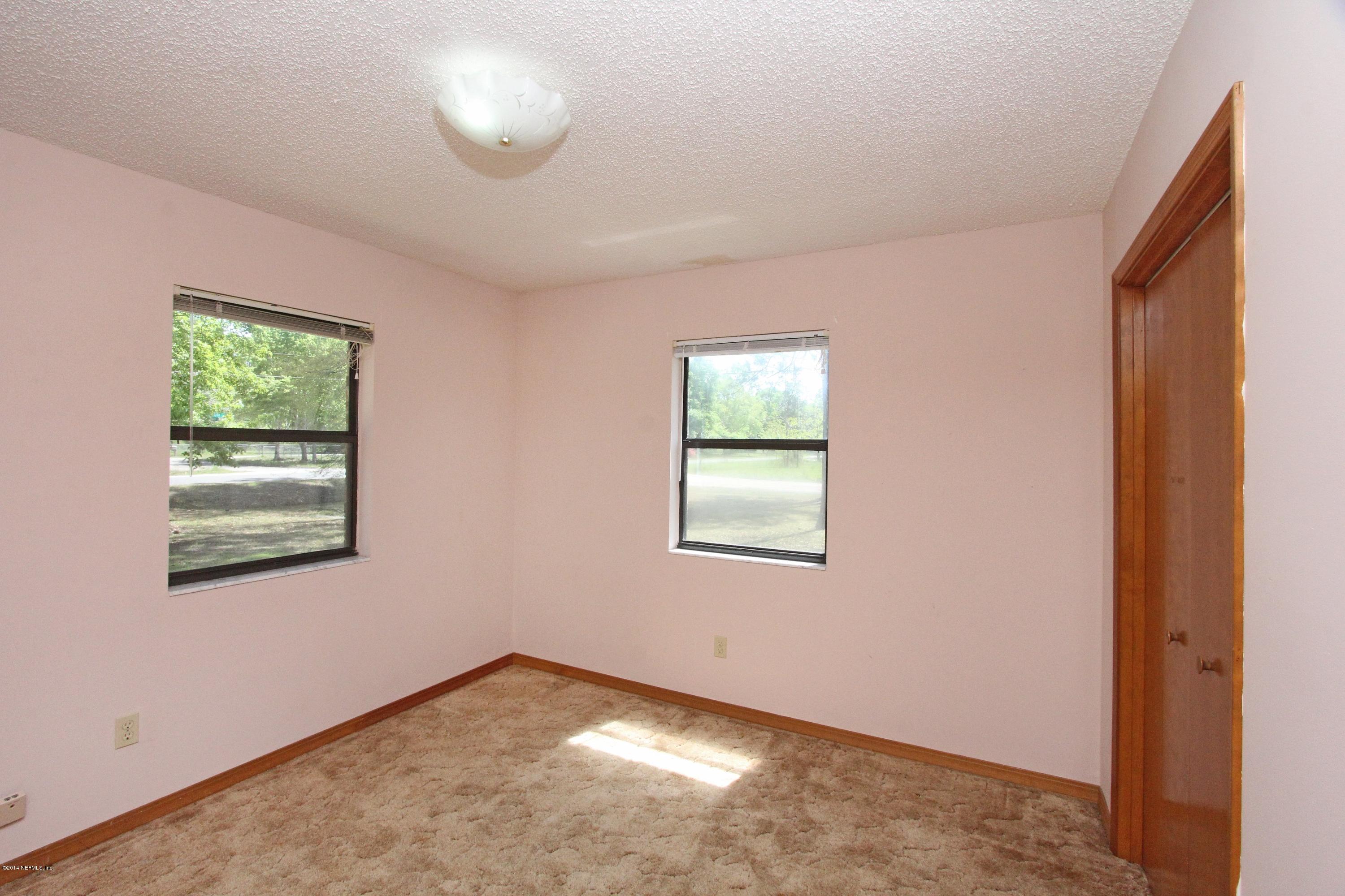 54421 Sheffield Road Callahan, FL 32011 - Photo 9 of 16 an empty room with windows