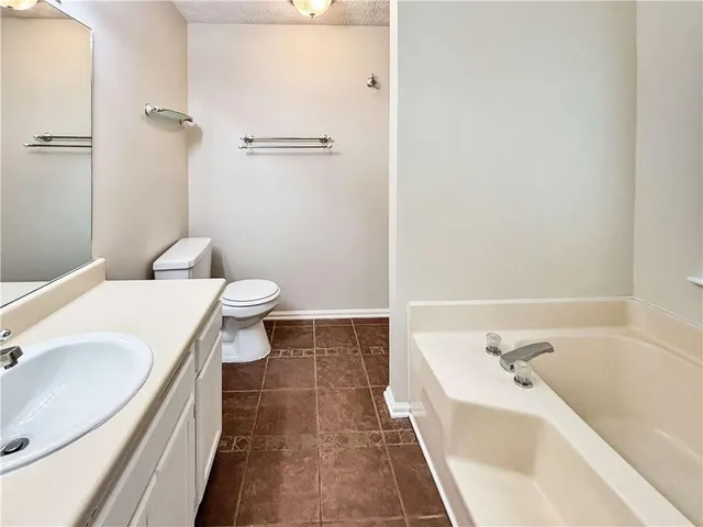 a bathroom with a sink and toilet