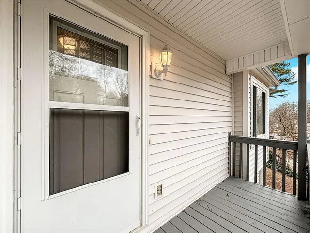 a view of a balcony with wooden floor