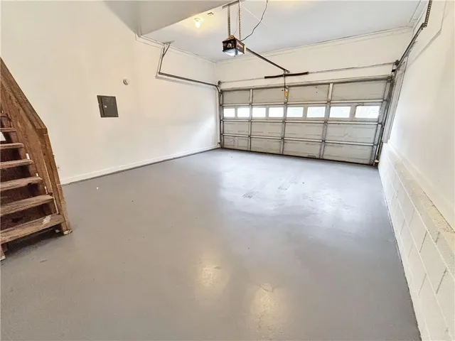a view of a garage with stairs